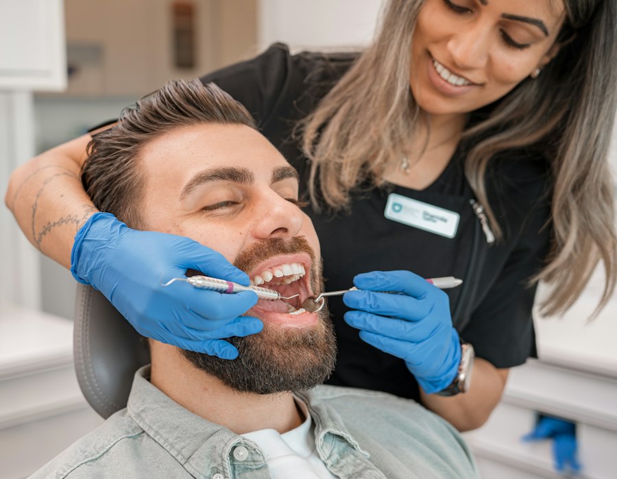 A smiling patient in the chair with a Truly dentist