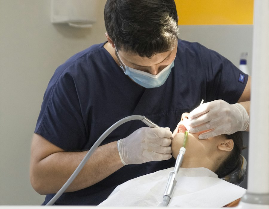 A dentist treating a patient