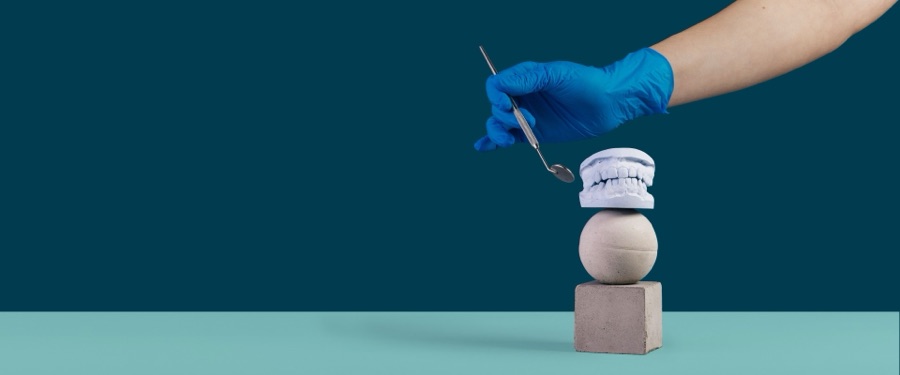 A Boris Dental Lab technician finishing a crown